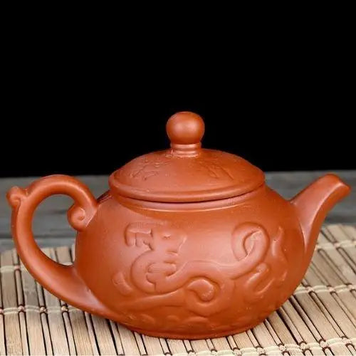 Red Yixing clay teapot with dragon design