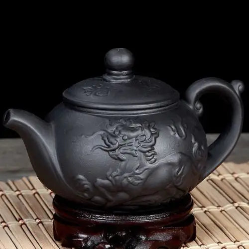 Yixing clay teapot with dragon, side view