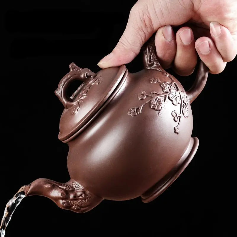 Yixing zisha clay teapot, 500 ml, flower relief detail, side profile view