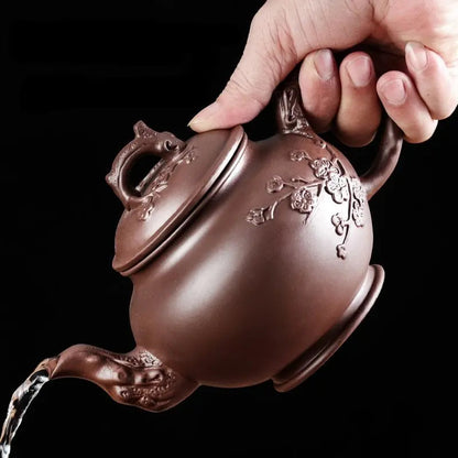 Yixing zisha clay teapot, 500 ml, flower relief detail, side profile view