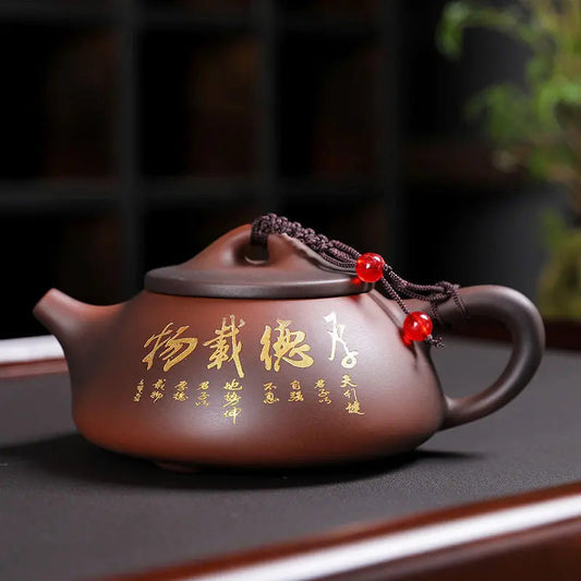 Brown Yixing Zisha teapot with carved longevity symbols, side view