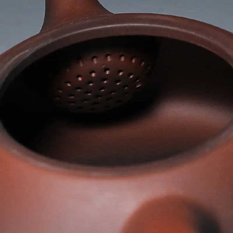 Close-up of unglazed Yixing clay porous texture on teapot surface