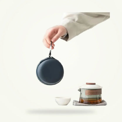 Zen travel tea set for three, porcelain teapot and cups on plain background